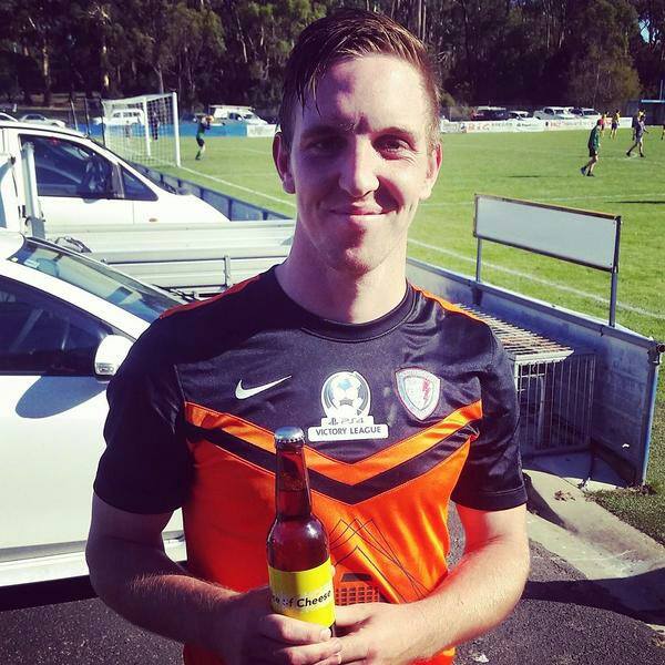 Mann with his Slice of Cheese stubby which he received for a 3 goal, 2 assist man of the match performance.